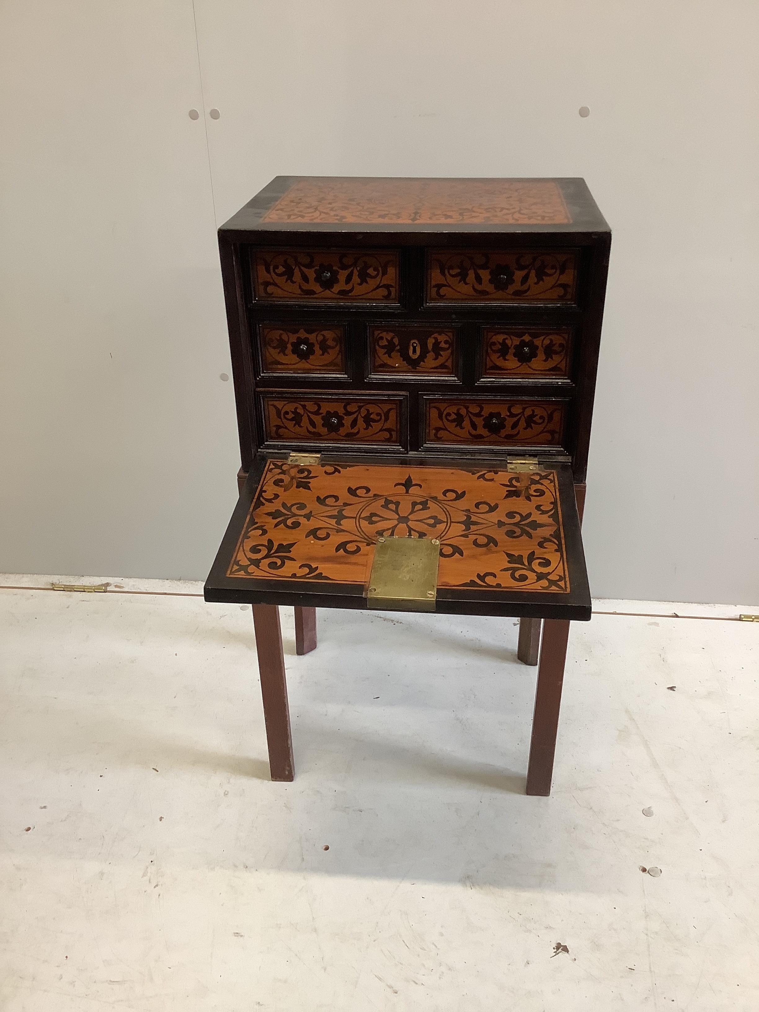 A 17th century style marquetry and ebony collector's chest, on associated stand, width 43cm, depth 33cm, height 83cm